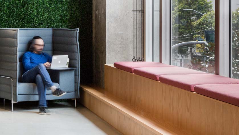 man sitting in a sustainable office